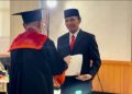 Ketua DPRD Provinsi Jambi, Edi Purwanto saat Usai Menjalankan Sidang Promosi Doktor di Unja (06/09). Foto/Ist